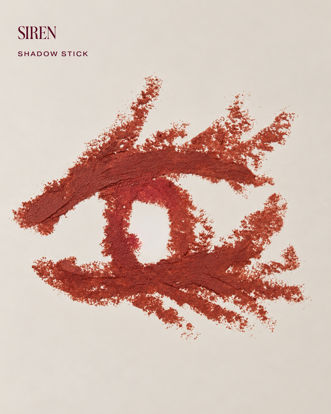 Shadow Stick swatch in Siren, a warm rust red